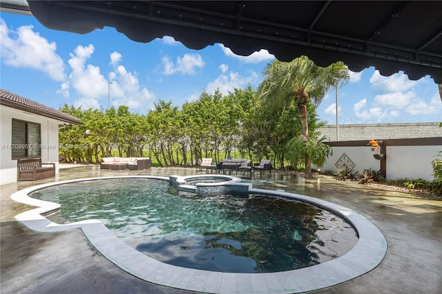 view of swimming pool with outdoor lounge area, a patio area, and an in ground hot tub