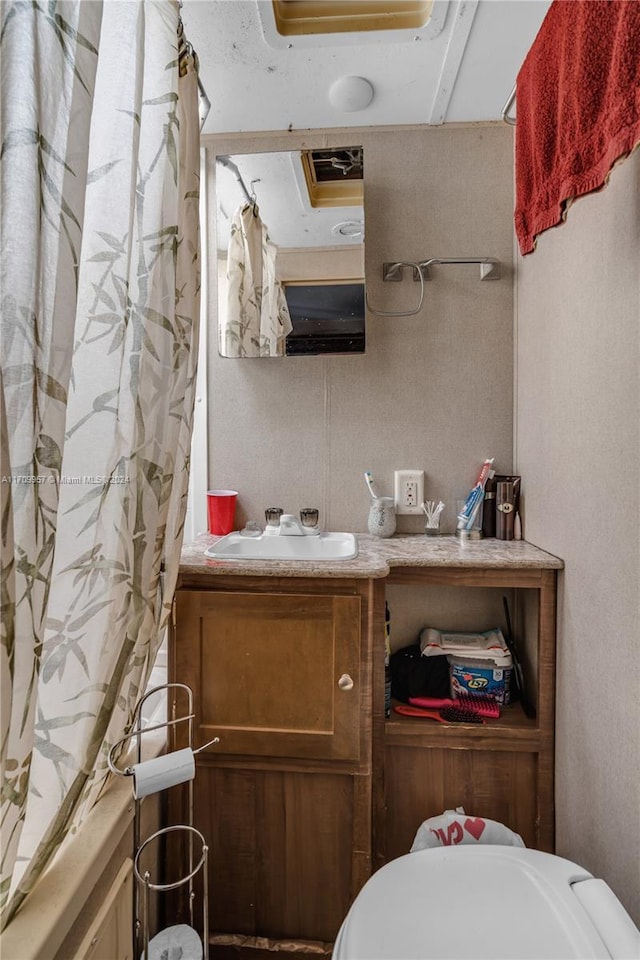 bathroom with shower / bathtub combination with curtain and vanity