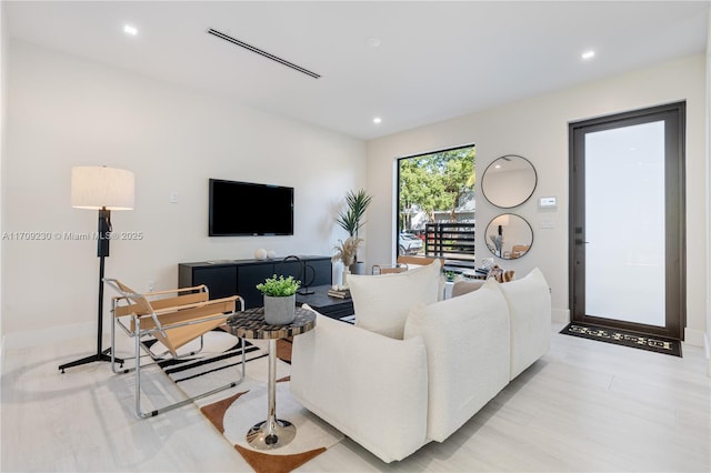 living room with light hardwood / wood-style floors