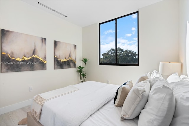 bedroom with light hardwood / wood-style flooring