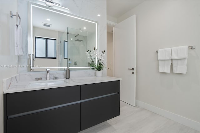 bathroom featuring vanity and walk in shower