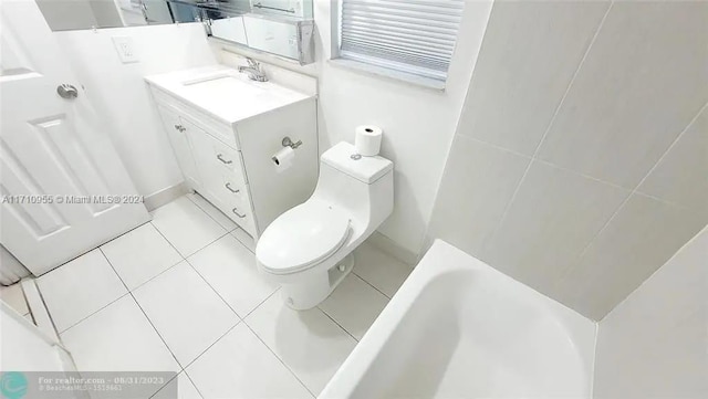 bathroom featuring tile patterned flooring, vanity, toilet, and a bath