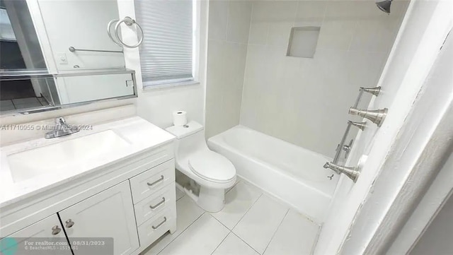 full bathroom featuring tile patterned flooring, vanity, toilet, and tiled shower / bath