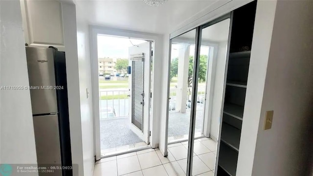 entryway featuring light tile patterned floors