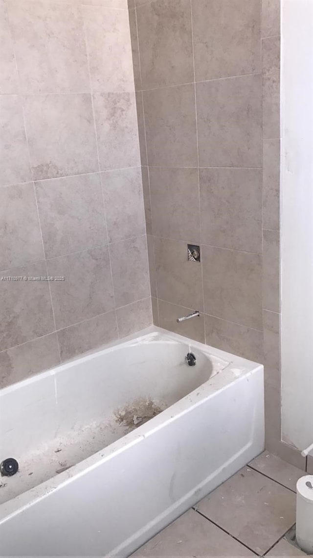 388 NE 208th Ter Unit 388, Miami, FL 33179 - bathroom featuring tile patterned floors and a tub to relax in
