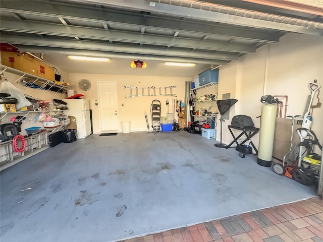 garage featuring white fridge