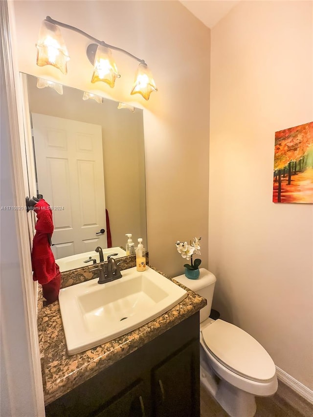 bathroom with vanity and toilet