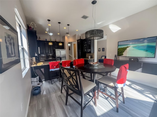 dining room with light wood-type flooring