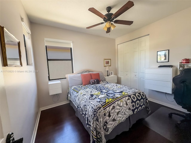 bedroom featuring ceiling fan, a closet, and dark hardwood / wood-style floors