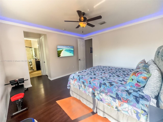 bedroom with dark hardwood / wood-style flooring, ceiling fan, and ornamental molding