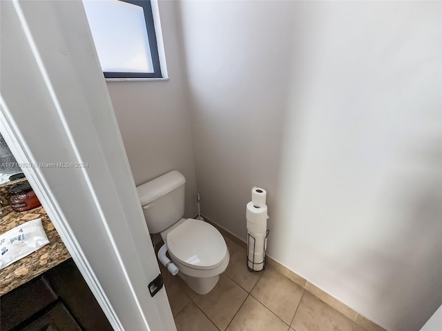 bathroom featuring tile patterned floors and toilet