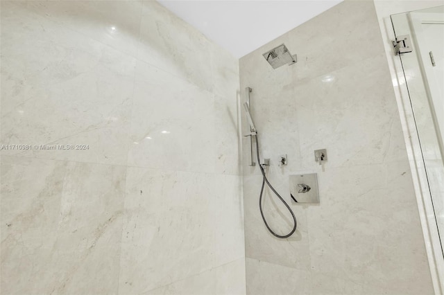 bathroom with a tile shower