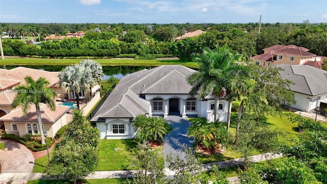 birds eye view of property with a water view