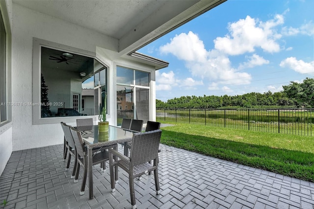 view of patio / terrace with outdoor dining area and fence