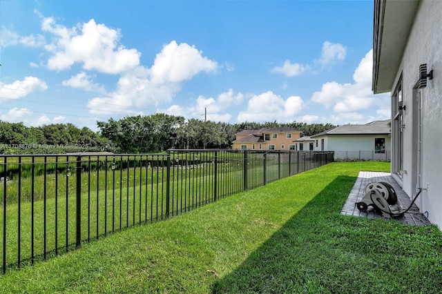 view of yard with a fenced backyard