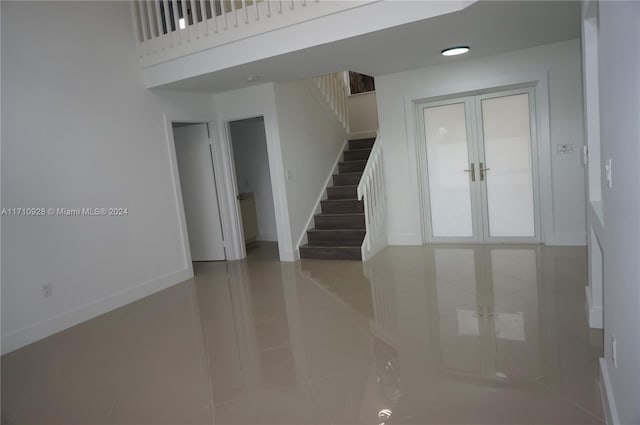 interior space with french doors and tile patterned flooring