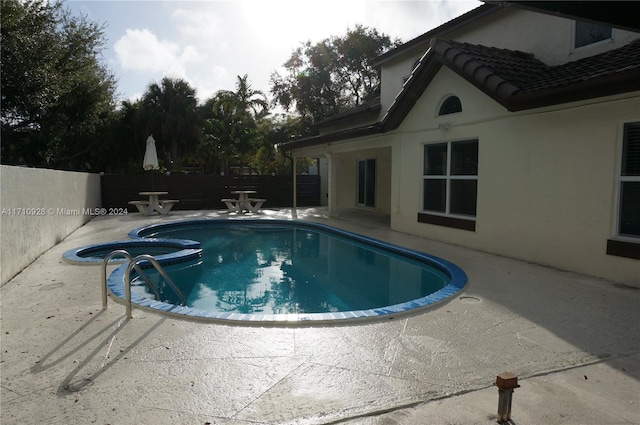 view of pool featuring a patio