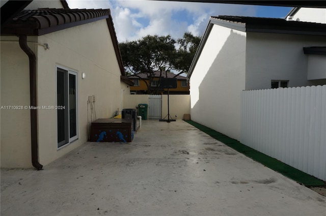 view of property exterior with a patio