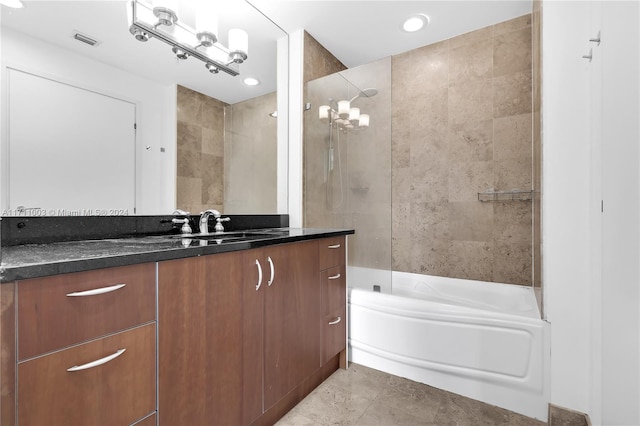 bathroom with vanity, tile patterned floors, and tiled shower / bath