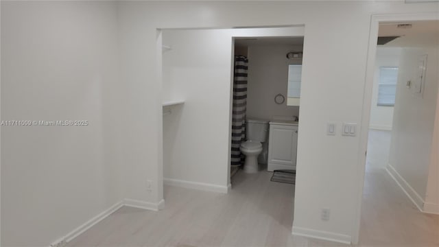 13455 SW 9th Ct Unit 113J, Pembroke Pines, FL 33027 - corridor featuring baseboards and light wood-style floors