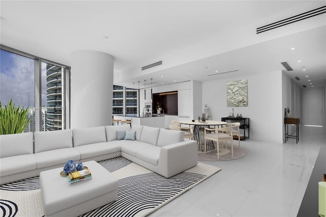 living room featuring expansive windows