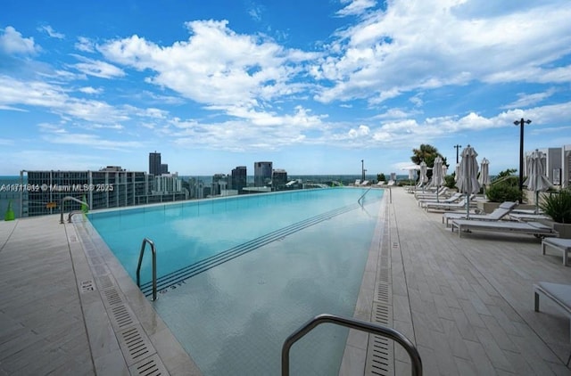 view of swimming pool with a patio