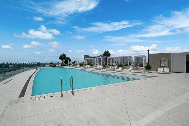 view of swimming pool featuring a patio