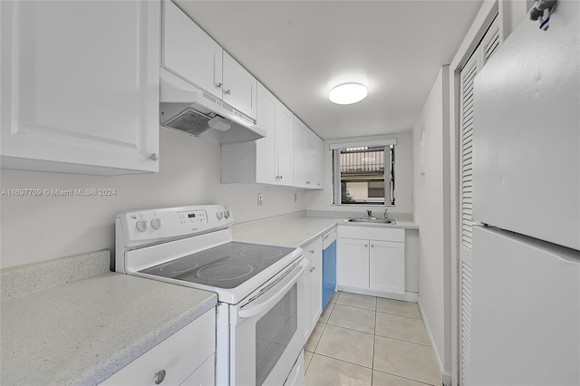 kitchen with white cabinetry, light tile patterned flooring, white appliances, and sink