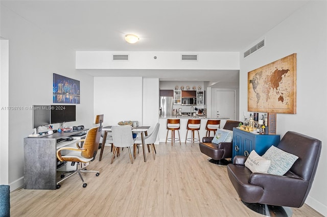 office with light hardwood / wood-style flooring