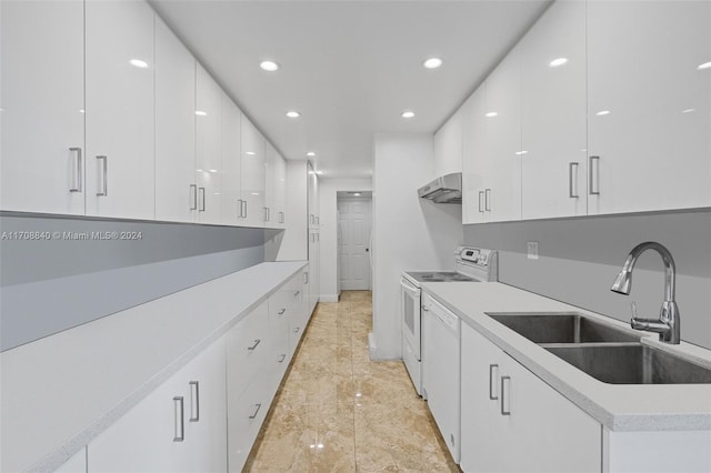 kitchen featuring white range with electric cooktop, sink, and white cabinets