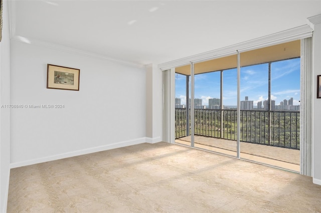 unfurnished room with floor to ceiling windows, plenty of natural light, and crown molding