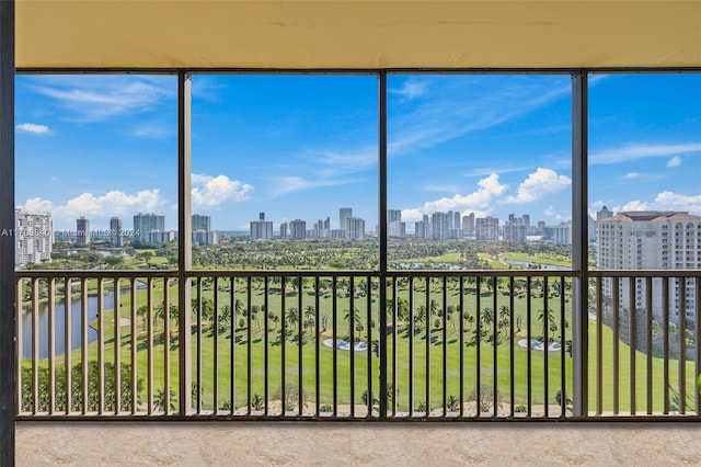 unfurnished sunroom featuring a water view