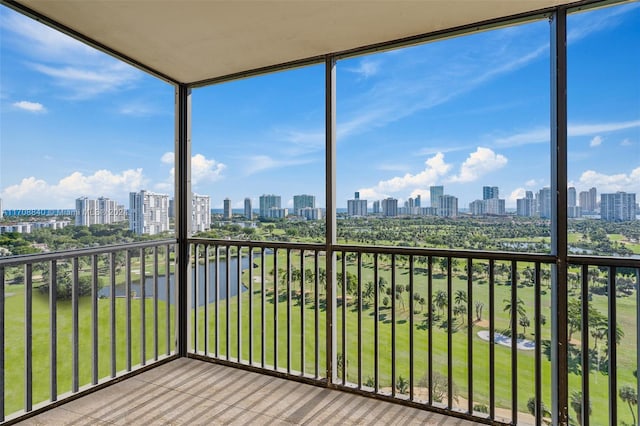 unfurnished sunroom with a water view