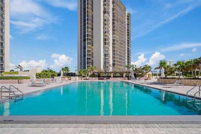 view of swimming pool featuring a patio area