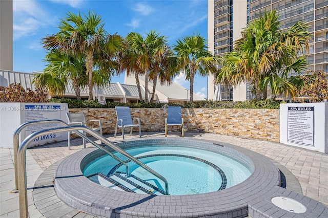 view of pool with a community hot tub