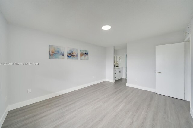 unfurnished room featuring light hardwood / wood-style flooring