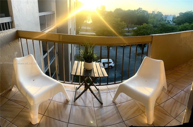 view of balcony at dusk