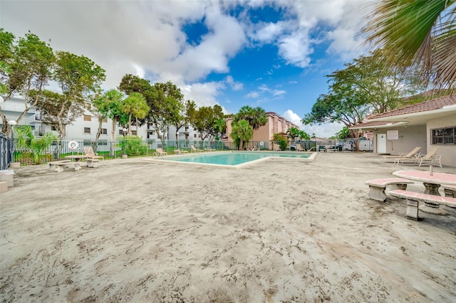 view of swimming pool with a patio