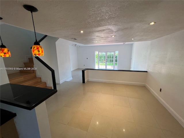 empty room featuring a textured ceiling