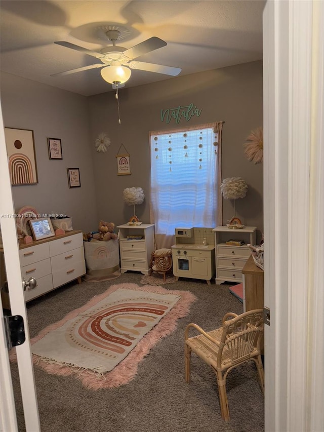 carpeted bedroom with ceiling fan