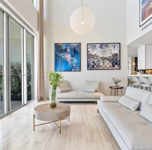 living room with a towering ceiling