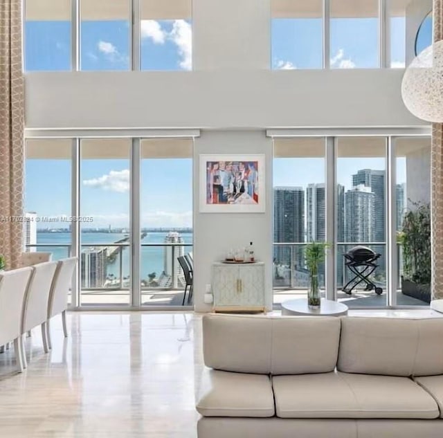 living room with a wealth of natural light and a water view