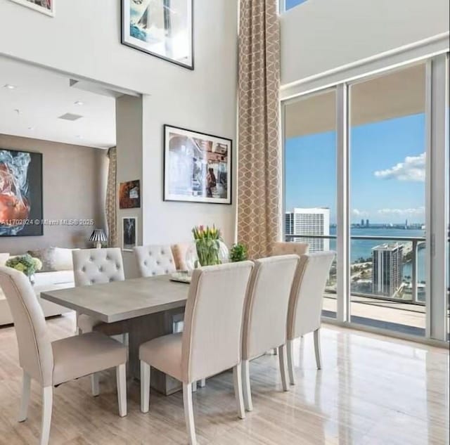 dining area featuring a water view