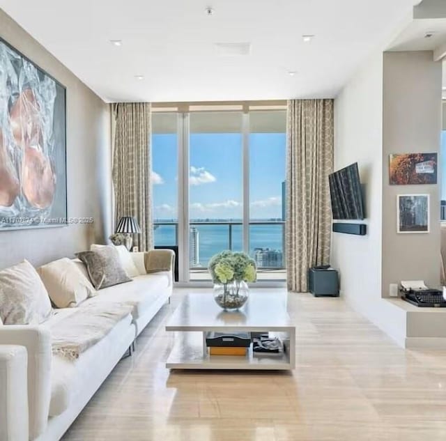 living room featuring floor to ceiling windows