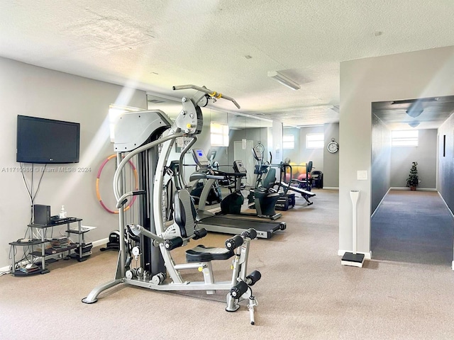 workout area featuring a textured ceiling