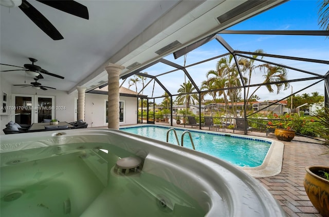 view of pool with a lanai, a patio area, and french doors