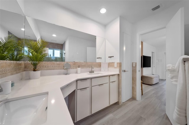 bathroom featuring vanity and hardwood / wood-style flooring