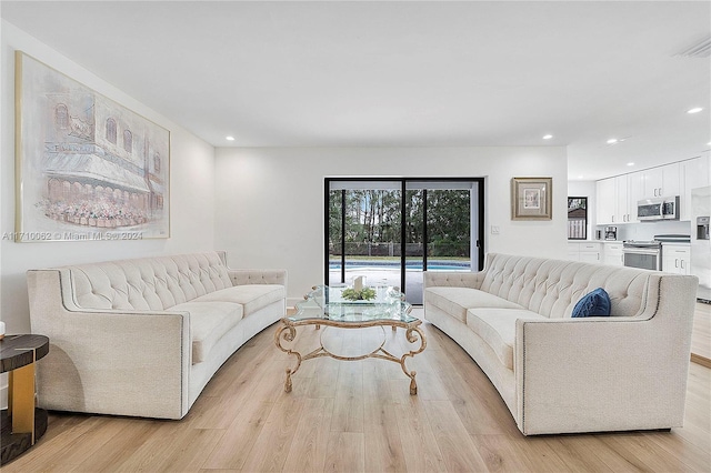 living room with light hardwood / wood-style flooring