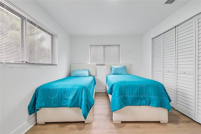 bedroom with wood-type flooring