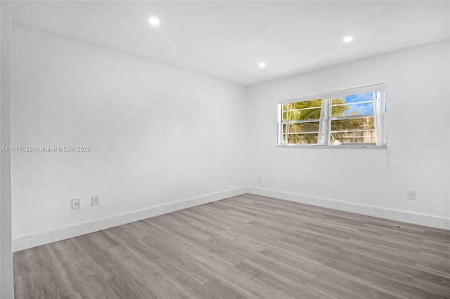 unfurnished room with light hardwood / wood-style flooring